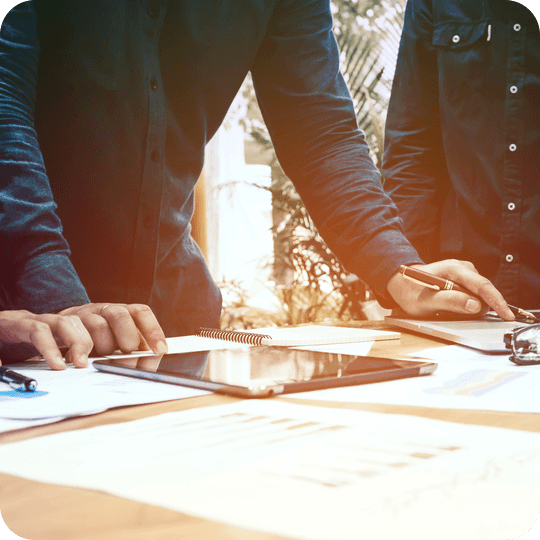 Accountant at table working with professional services firm client